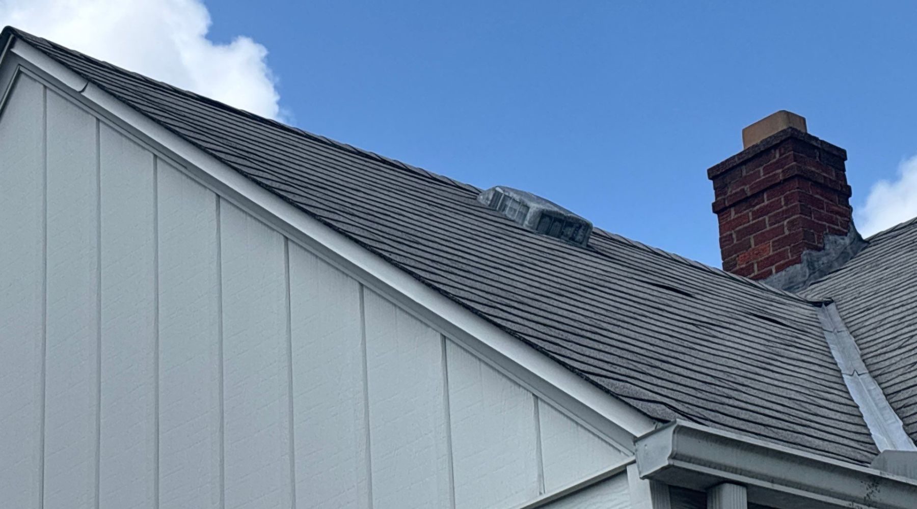 Local roofing services team working on a residential roof in Monclova OH