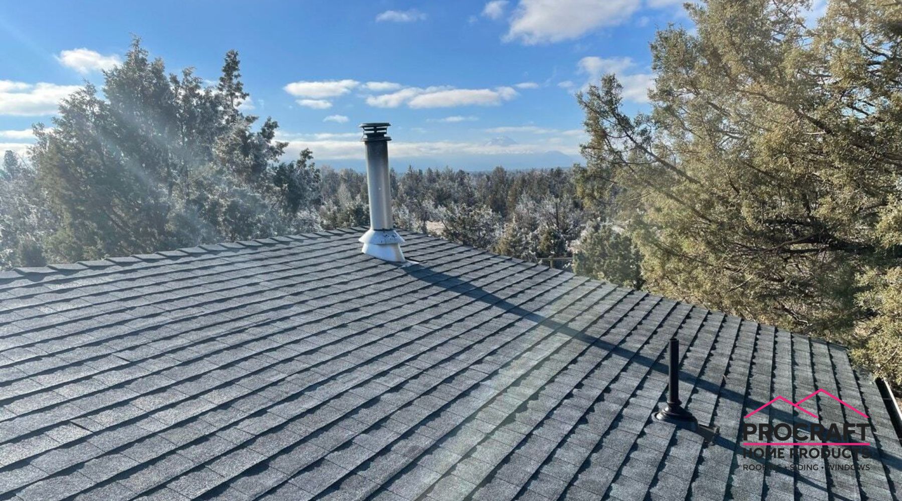 Roofing crew completing a full roof replacement on a home in Blissfield MI