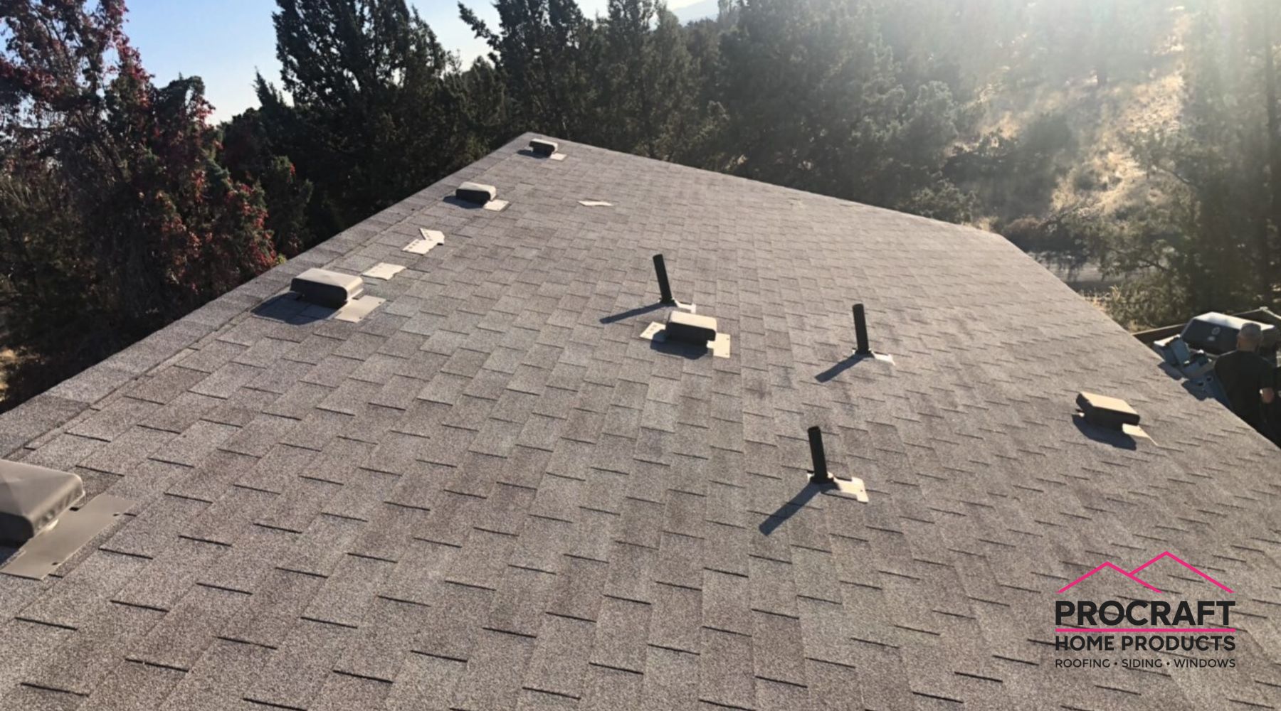 Pro Craft Home Products roofing team working on a residential roof in Adrian MI