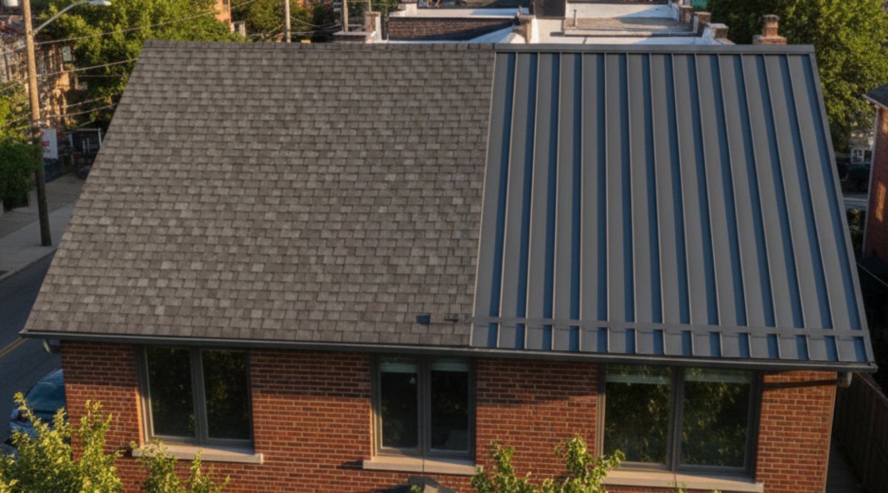 asphalt shingle and metal roofing contractors House roof showing half asphalt shingles and half standing seam metal roofing